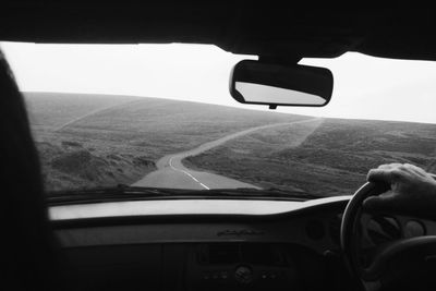 Cropped image of car moving on road