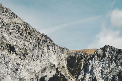 Low angle view of rock formations against sky