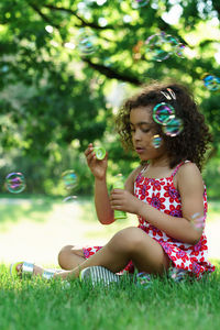 Side view of girl playing in park