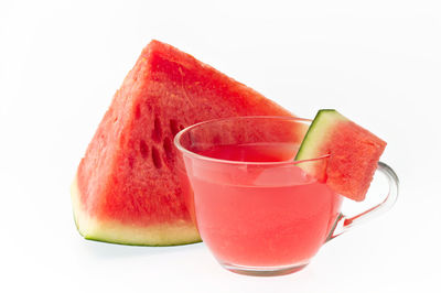 Close-up of red fruit against white background