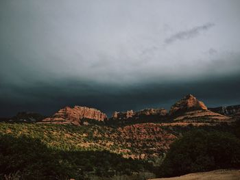 Scenic view of mountain against cloudy sky