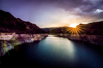 Scenic view of lake against sky during sunset