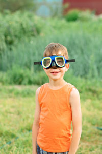 Portrait of a boy outdoors in swimming goggles