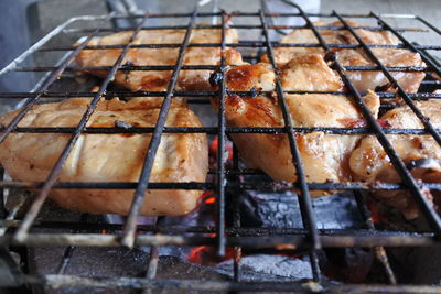 Close-up of meat on barbecue grill