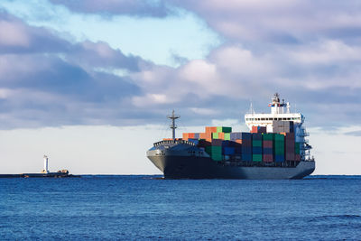 Boats in sea against sky