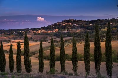 Scenic view of landscape against sky at sunset