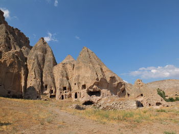 Panoramic view of rocky mountains against sky