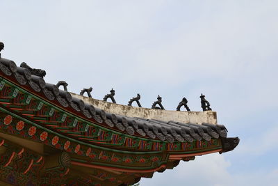 Low angle view of statue on roof