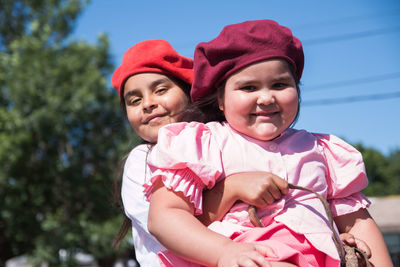 Argentinian little sisters wearing traditional clothing