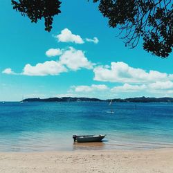 Scenic view of sea against blue sky