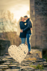 Couple standing on field