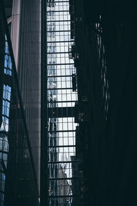 Low angle view of building seen through window