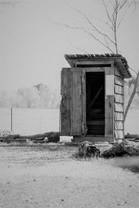 Built structure on field against sky during winter