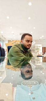 Portrait of young man on table