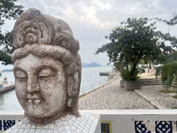 Close-up of statue against sky