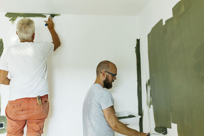 Men painting walls