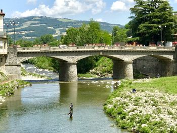 Bridge over river against sky