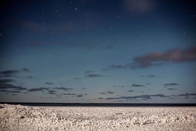 Scenic view of sea against sky at night