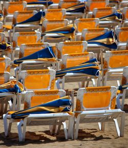 Empty chairs and tables in row
