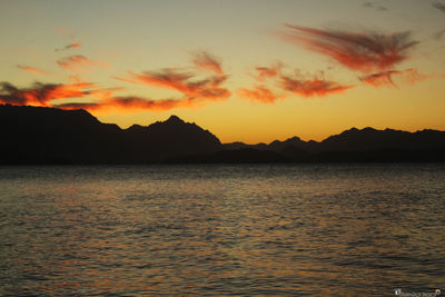 Scenic view of sea against romantic sky at sunset