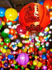 Low angle view of illuminated lanterns hanging in market