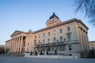 Low angle view of building against blue sky