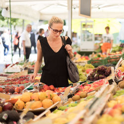 Beautiful woman standing in market