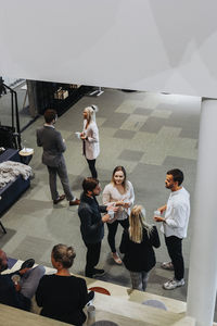 Coworkers talking on corridor