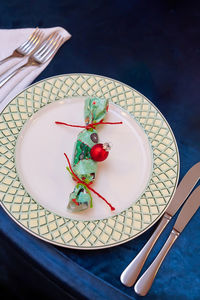 High angle view of fruits in plate on table