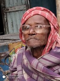 Portrait of woman with pink mask