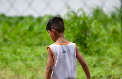 Young man standing on field