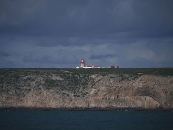 Lighthouse by sea against sky cabo são vicente