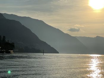 Scenic view of lake against sky during sunset