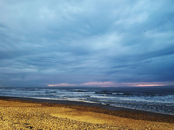 Scenic view of beach against sky