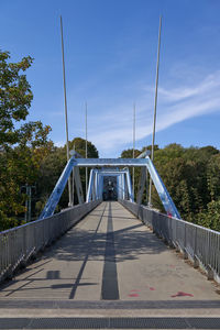 Footbridge against sky