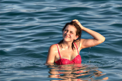 Woman swimming in sea