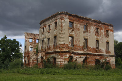 Low angle view of old building against sky