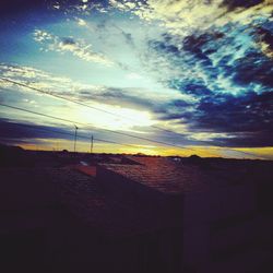 Built structure against sunset sky