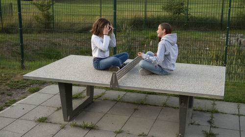 Young couple sitting on bench
