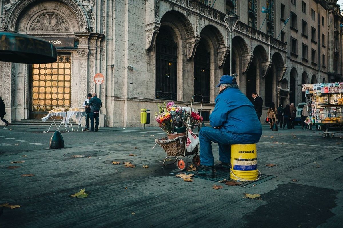 WOMAN STANDING IN CITY