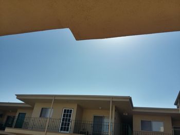 Low angle view of building against blue sky