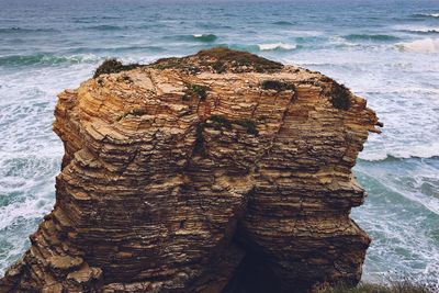 High angle view of rock formation on beach