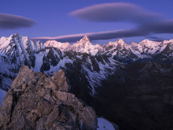 Scenic view of snowcapped mountains against sky.