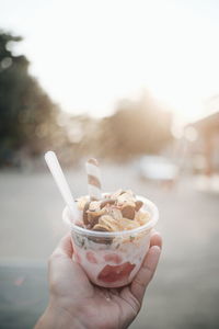 Person holding ice cream cone