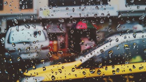 Close-up of rain drops on road