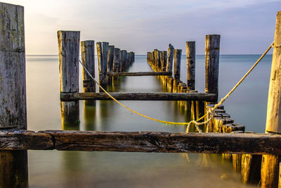 Pier over sea against sky