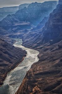 High angle view of river passing through mountains