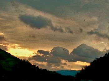 Scenic view of landscape against cloudy sky