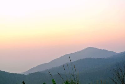 Scenic view of silhouette mountains against clear sky