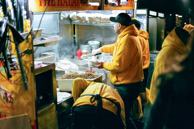 Rear view of man in store